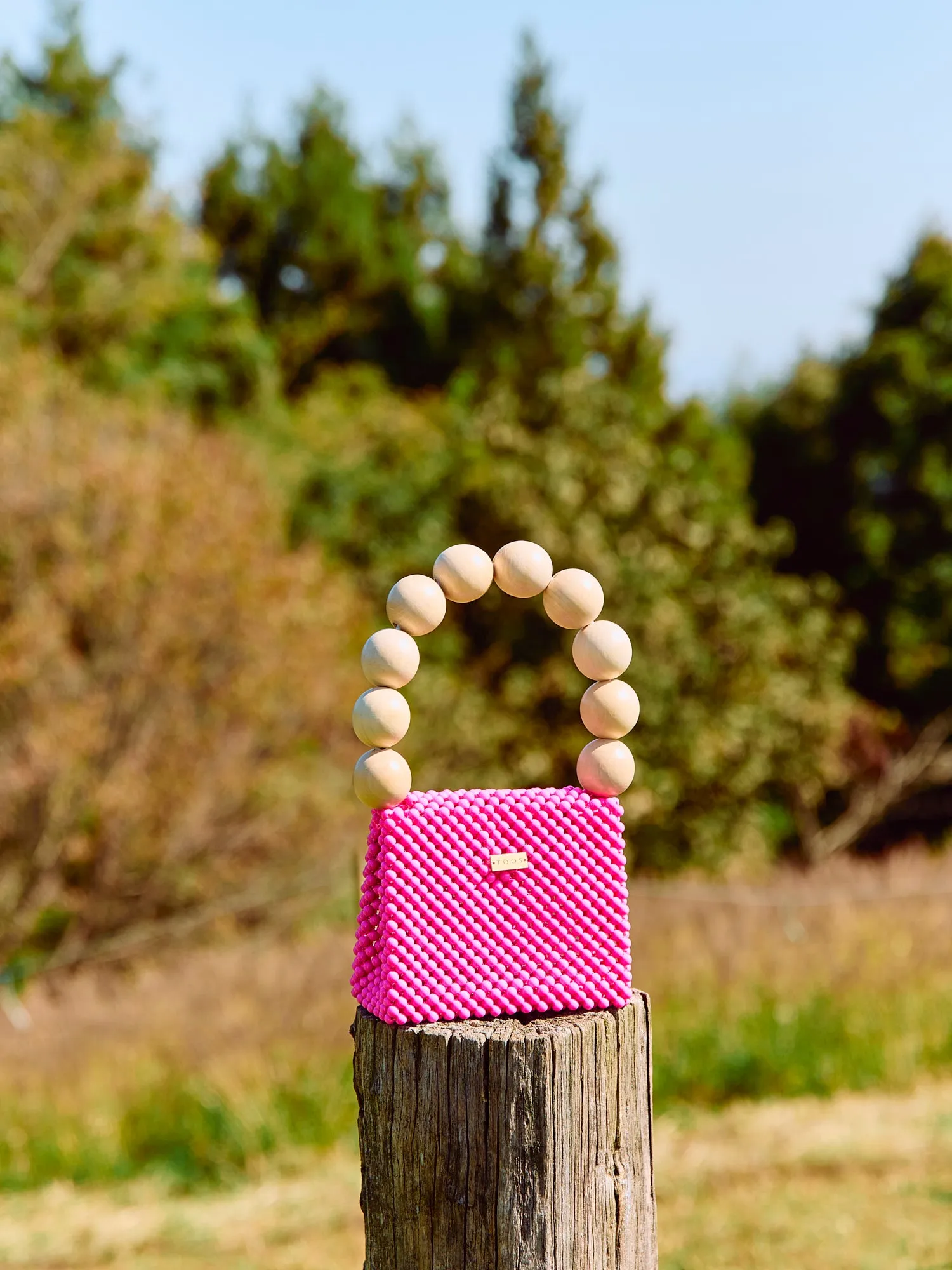 wood ball hand bag（vivid pink）